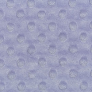 May include: A close-up of a light purple fabric with a textured pattern of small, raised circles.