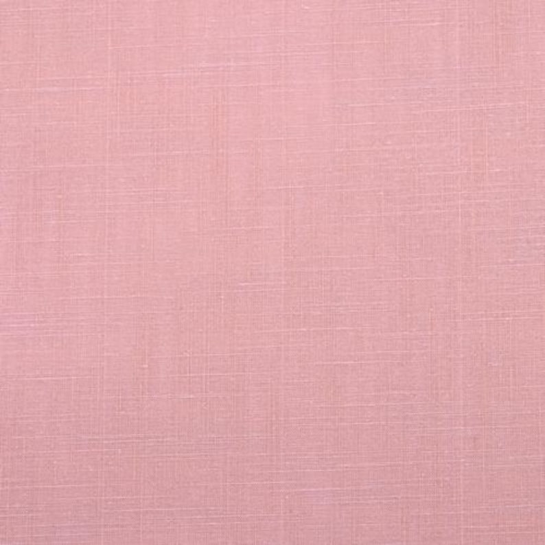 May include: A solid pink fabric with a subtle woven texture.