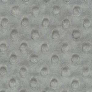May include: Close-up of a gray textured fabric with a repeating pattern of small raised circles.