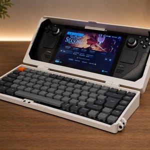 May include: A white portable gaming console dock with an integrated mechanical keyboard featuring dark gray keys and one orange key. The console screen displays the Hollow Knight Silksong game interface with black controllers on both sides.
