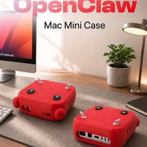May include: Two red Mac Mini cases with the text "OpenClaw Mac Mini Case" are displayed on a desk. The cases are square with rounded edges, black accents, and white hooks. A computer monitor, desk lamp, and small potted plant are also visible.