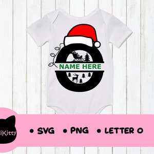 May include: White baby onesie with a black and red Christmas-themed monogram letter O. The letter O is decorated with a Santa hat, a reindeer, a Christmas tree, and a sleigh. The text "NAME HERE" is written in green on a white banner.