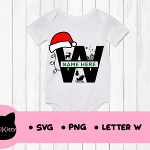 May include: White baby onesie with a black letter W decorated with a red Santa hat, a green Christmas tree, a reindeer, and a gift box. The text "NAME HERE" is written on a green banner.
