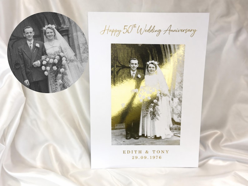 May include: A white card with a gold foil image of a couple and the text "Happy 50th Wedding Anniversary". The card also features a black and white photo of the couple and the names "EDITH & TONY" and the date "29.09.1976".