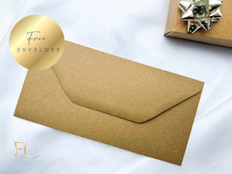 May include: A brown envelope with the word "FOIL" embossed on the front. A gold sticker with the words "Free Envelope" is in the upper left corner. A gift box with a silver bow is in the background.