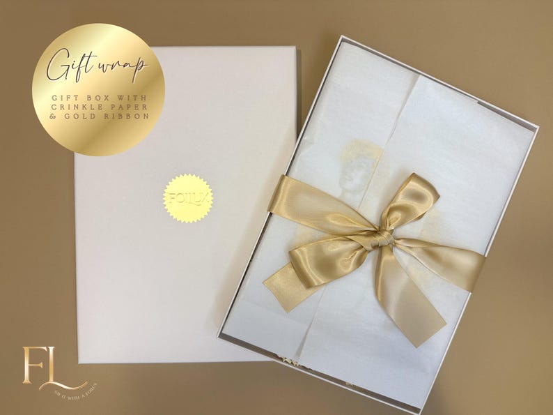 May include: A white gift box with a gold ribbon tied in a bow. The box is open, revealing white tissue paper. The lid of the box is closed. The text "Gift wrap" is on a gold circle.