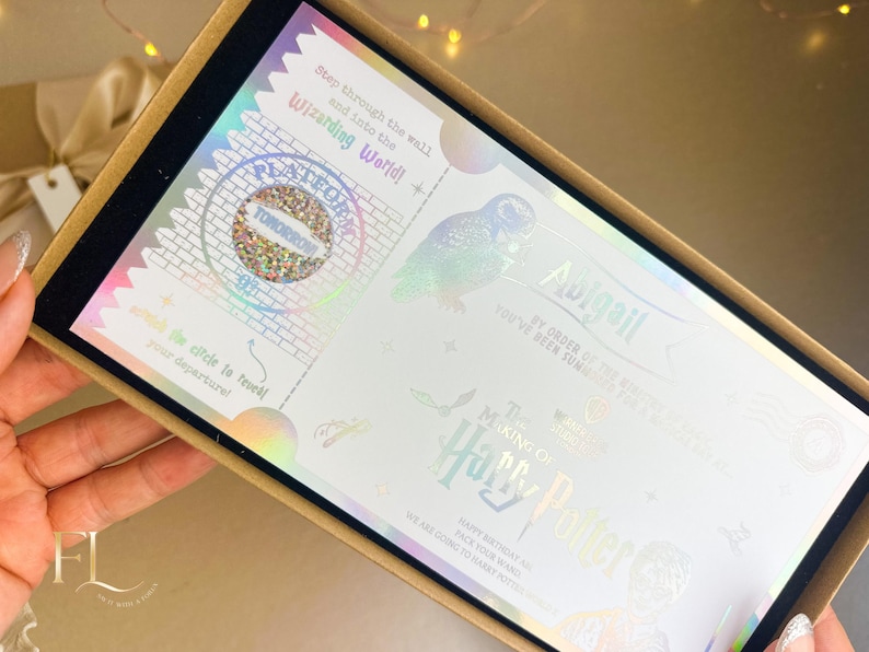 May include: A decorative box containing a holographic invitation with text that reads "Step through the wall and into the Wizarding World!" and "The Making of Harry Potter". The invitation features an owl illustration.