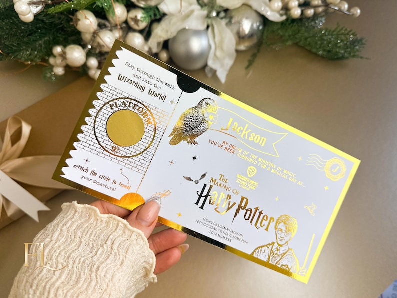 May include: A gold-edged ticket with the text "The Making of Harry Potter" and "Platform 9&frac34;". The ticket features an owl illustration and the name "Jackson". The text includes "Merry Christmas Jackson" and "Love Mum xxx".