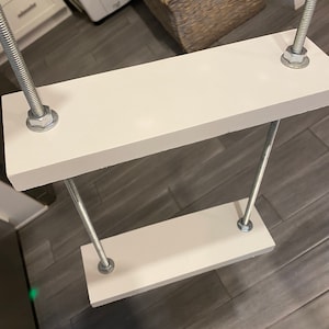Hanging plant shelf for window