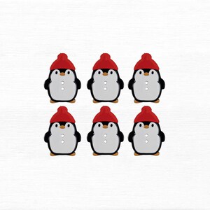May include: Six penguin-shaped buttons. Each button features a black body, white belly, and a red knit cap. The buttons have two small holes for sewing. The penguins are arranged in two rows of three on a white background.