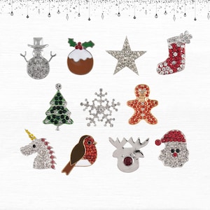 以下が含まれることがあります： クリスマスをテーマにしたラインストーンの装飾品のコレクション。雪だるま、クリスマスプディング、星、靴下、クリスマスツリー、雪の結晶、ジンジャーブレッドマン、ユニコーン、ロビン、トナカイ、サンタクロースが含まれています。