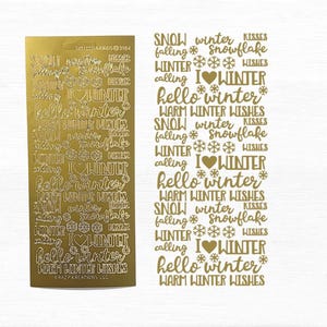 Könnte beinhalten: Goldfolie-Aufkleberbogen mit winterlichen Wörtern und Phrasen, darunter "Schnee", "Winter", "Schneeflocke", "Ich liebe Winter", "Hallo Winter" und "Warme Wintergrüße".