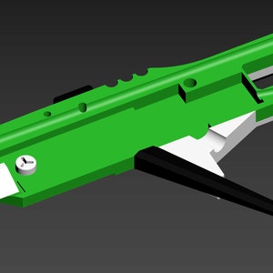 Pode incluir: Uma arma de brinquedo de pl&aacute;stico verde e preto com uma al&ccedil;a branca. A arma tem uma superf&iacute;cie texturizada e um pequeno parafuso no lado.