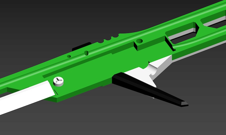 Pode incluir: Uma arma de brinquedo de pl&aacute;stico verde e preto com uma al&ccedil;a branca. A arma tem uma superf&iacute;cie texturizada e um pequeno parafuso no lado.