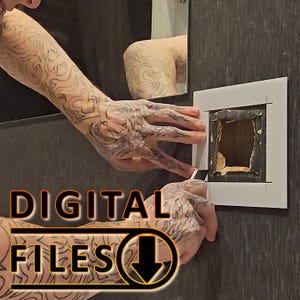 May include: A person is using a white template to mark out a square on a dark gray wall. The template has a smaller square cut out of the center. The text "DIGITAL FILES" is visible in the lower left corner of the image.