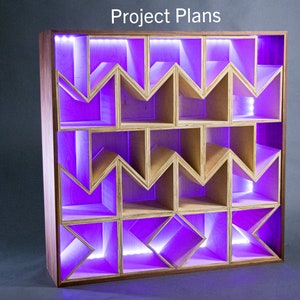 May include: A wooden shelf unit with a geometric design and purple LED lights. The shelves are made of plywood and have a natural wood finish. The unit is lit from behind with purple LED lights, creating a modern and stylish look.