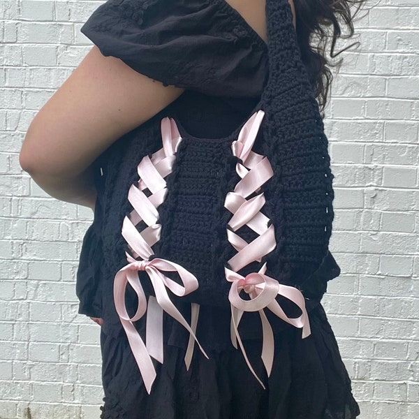 crochet cinta bag | black crochet shoulder bag with pink satin bows | handmade crocheted coquette purse and lace up ribbons | slow fashion