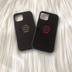 May include: Two black phone cases with a pink inscription that reads "YOUR CUSTOM QUOTE HERE".