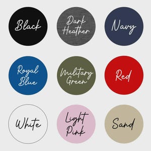 May include: A color chart featuring nine circular swatches labeled Black, Dark Heather, Navy, Royal Blue, Military Green, Red, White, Light Pink, and Sand. Each circle displays the color name in a white or black cursive script font.