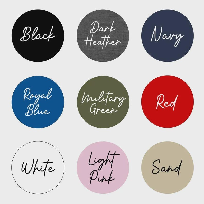 May include: A color chart featuring nine circular swatches labeled Black, Dark Heather, Navy, Royal Blue, Military Green, Red, White, Light Pink, and Sand. Each circle displays the color name in a white or black cursive script font.