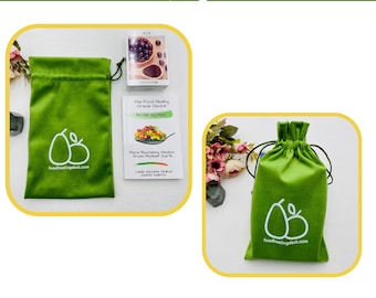 May include: A green velvet pouch with a white pear logo and the text "foodhealingdeck.com" is shown next to a set of oracle cards. The cards are titled "The Food Healing Oracle Deck" and "Second Helpings". The text "More Nourishing Wisdom from Mother Earth" is also visible on the cards. The text "Perfect for on the go fun!" is displayed below the image.