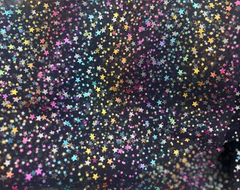 Tela de malla de tul con destellos navideños - 147 cm de ancho. Tela colorida e irresistible para tutús, faldas y disfraces. Se vende por medio metro.