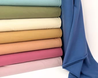 Tejido de sudadera orgánico French Terry, 95 % algodón y 5 % elastano, con reverso cepillado. Rosa, verde, natural, suave, para confección infantil.