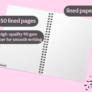 May include: A white notebook with a black spiral binding. The notebook has 150 lined pages and is made with high-quality 90 gsm paper for smooth writing. The text "lined paper" is written in black on a gray oval shape at the top right corner of the image.