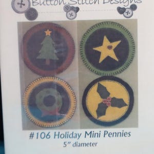May include: A package of four holiday mini pennies, each with a different design: a Christmas tree, a star, a wreath, and holly. The pennies are approximately 5 inches in diameter, with a stitched border and felt appliqués.