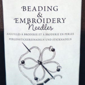 May include: Package of John James beading and embroidery needles. The package is white with the text "Crafter's Collection" in pink. It includes 14 hand sewing needles neatly packaged in small envelopes.