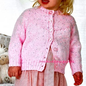 Child cardigan with knitted yolk detail to knit using double knit yarn. Sizes 6 months-9 years. Easy knit. Instant download knitting pattern