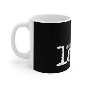 May include: White ceramic mug with a black background and white text that reads "serial killer" in a stylized font.