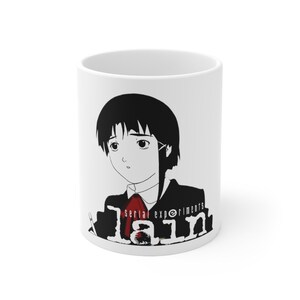 May include: White ceramic mug with a black and white illustration of a female anime character with black hair and a red tie. The text "Serial Experiments Lain" is printed in black below the character.