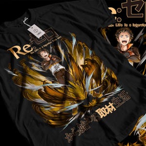 May include: Black t-shirt featuring a gold and white graphic of an anime character with the text "Re: Zero" and "から始める取材生活" in Japanese.