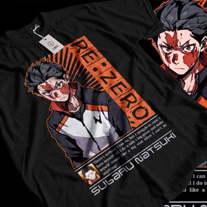 May include: Black t-shirt featuring a graphic of a character from the anime Re:Zero - Starting Life in Another World. The character is Subaru Natsuki, with the text "RE:ZERO" and "Subaru Natsuki" on the shirt. The text reads: "There's nothing I can do, but I struggle in vain! I hate myself. All I do is talk a big game, and make myself sound like a big shot when I can't do anything!"