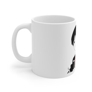 May include: White ceramic mug with a black and white illustration of an anime character with black hair and a red shirt holding a pencil.