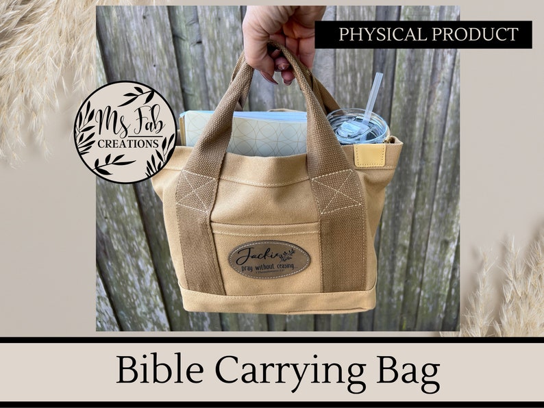 May include: A tan canvas Bible carrying bag with brown straps and a brown leather patch that says "Jackie's Pray Without Ceasing".