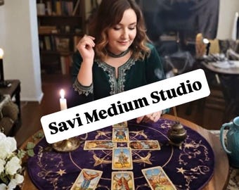May include: A round purple velvet tarot cloth featuring gold embroidered celestial patterns and stars, arranged with seven tarot cards in a cross formation, a lit white candle in a brass holder, and a small incense burner on a wooden table.