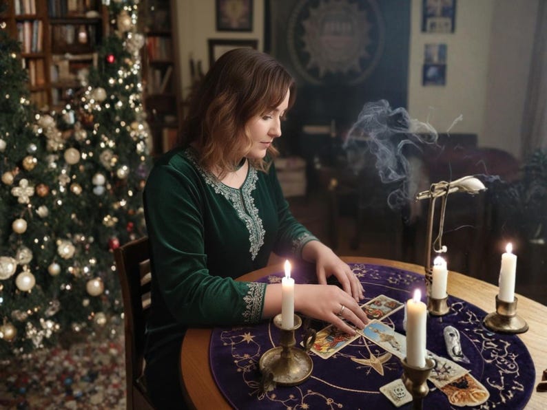 May include: A person in a green velvet dress with silver embroidery sits at a table with tarot cards. Lit candles and a Christmas tree with lights are in the background. Smoke rises from a metal stand.