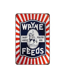 May include: A vintage-style metal sign with red and white stripes and a blue center. The sign reads "Wayne Feeds" and features a black and white illustration of a person riding a horse. The text "Dairy Horse Poultry Hog" is printed below the illustration.