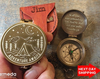 May include: A brass compass with a chain and a leather pouch. The compass face has a design of a tent, mountains, trees, and a crescent moon. The pouch has the name "Jim" engraved on it. The compass lid has the inscription "In all your ways acknowledge Him, And He shall direct your paths. Proverbs 3:6".