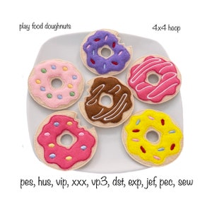 May include: Six felt play food doughnuts on a white plate. The doughnuts are in various colors and have different toppings, including sprinkles, chocolate icing, and pink frosting. The text "play food doughnuts" and "4x4 hoop" is visible in the image.
