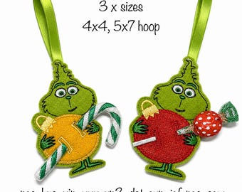 May include: Two green felt embroidered ornaments featuring a character holding a candy cane and a red ornament with a wrapped candy. Text reads: 3 x sizes 4x4, 5x7 hoop and pes, hus, vip, xxx, vp3, dst, exp, jef, pec, sew. Each has a lime green ribbon loop.