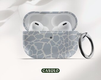 May include: A gray and white patterned protective case for AirPods with a carabiner. The case is open, revealing the white AirPods inside. The case has a "CASULO" logo on the bottom.