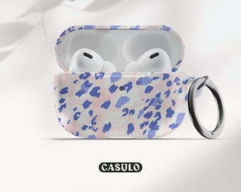 May include: A white and blue patterned protective case for AirPods with a carabiner. The case has a pink and blue abstract design with a CASULO logo.