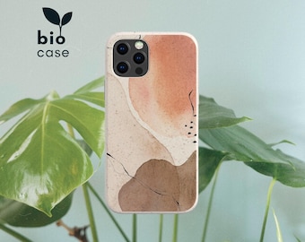 Puede incluir: Una funda de teléfono rectangular con un diseño de acuarela abstracto en tonos melocotón, beige y marrón oscuro con finos acentos de líneas negras. El texto bio case con un pequeño icono de hoja se encuentra en la esquina superior izquierda.