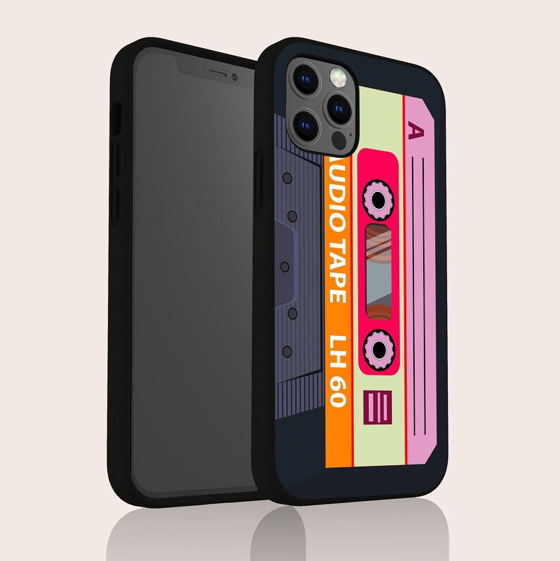 May include: Black phone case with a retro cassette tape design. The case features a pink and orange cassette tape with the text "AUDIO TAPE LH 60" and the letter "A" on the top right corner.