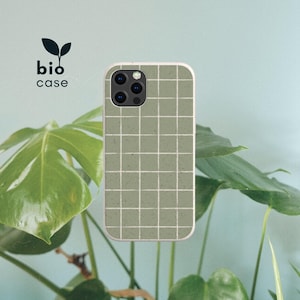 May include: A sage green phone case featuring a white grid pattern and a speckled texture. The case has a cutout for a triple-lens camera system. The text "bio case" with a small leaf icon is positioned to the left of the phone case.