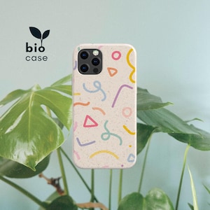 May include: A speckled off-white phone case featuring a colorful pattern of abstract shapes and squiggly lines in yellow, pink, orange, light blue, and purple. The text bio case with a small leaf icon is printed in black in the upper left corner.