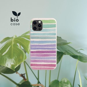 May include: A phone case featuring a horizontal striped pattern in a gradient of green, blue, purple, and pink hues. The case has a speckled texture and a cutout for the camera lens. The text bio case with a leaf icon is visible in the corner.
